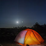Camping under moonlight near Dead Horse Point